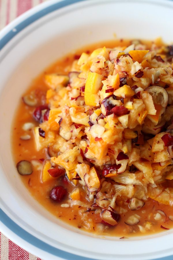 Orange Apple Cranberry Sauerkraut recipe. Easy recipe using seasonal fall fruit and cabbage. This would go perfect with pulled pork, chicken or a salad.