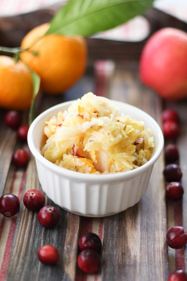 Orange Apple Cranberry Sauerkraut recipe. Easy recipe using seasonal fall fruit and cabbage. This would go perfect with pulled pork, chicken or a salad.