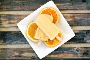 Milk kefir grains are used to ferment heavy cream into a thick sour cream like texture and combined with fresh squeezed orange juice, juicy mangos, vanilla and honey for this Orange Mango Kefir Creamsicle.