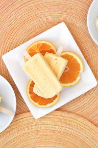 Milk kefir grains are used to ferment heavy cream into a thick sour cream like texture and combined with fresh squeezed orange juice, juicy mangos, vanilla and honey for this Orange Mango Kefir Creamsicle.