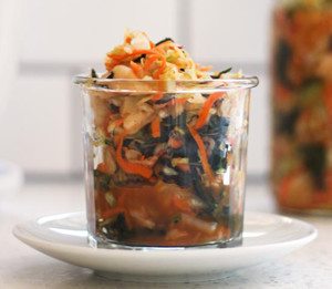 Recipe for Kale Kimchi. It's garlicky, spicy, savory and bursting with unami flavor and made with easy to find ingredients.