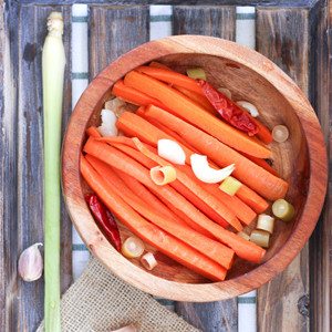 Gingery, sour, light lemongrass flavor and spicy, but still crunchy and sweet in the middle. Pickled Thai Carrot Sticks are healthy, delicious, are a great snack and simple to make.