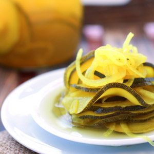 Garlic, ginger, turmeric and a few slices of onion flavor these Fermented Zucchini Pickles to sour, zingy perfection. Great added to burgers and sandwiches.