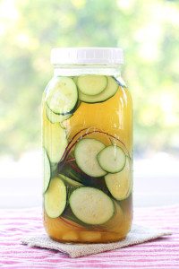 Garlic, ginger, turmeric and a few slices of onion flavor these Fermented Zucchini Pickles to sour, zingy perfection. Great added to burgers and sandwiches.